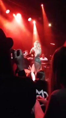 Jojo giving a lap dance during a concert