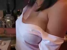Revealing tits while cooking