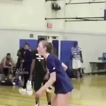 Girl from UCLA volleyball dunks in practice