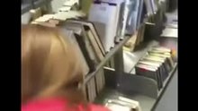Guy fucks a girl doggy style in a library and busts a load inside of a library book