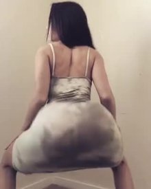 @russialit twerking in a grey dress
